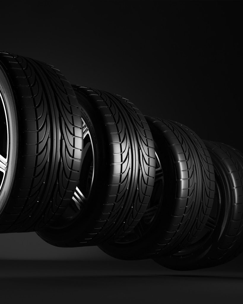 3d illustration. Four car wheels on black background. Poster or cover design.