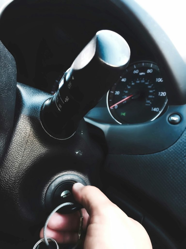 Turning the key to start the car to go to work